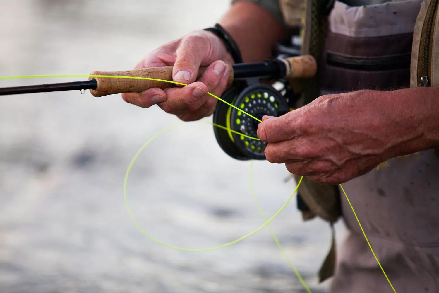 Elderly man fly fishing