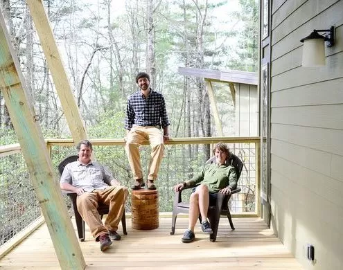 lane collin beth sitting on deck of cabin