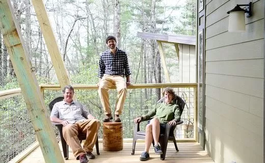 lane collin beth sitting on deck of cabin