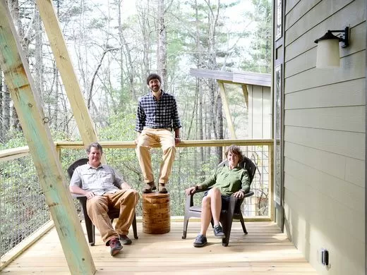 lane collin beth sitting on deck of cabin